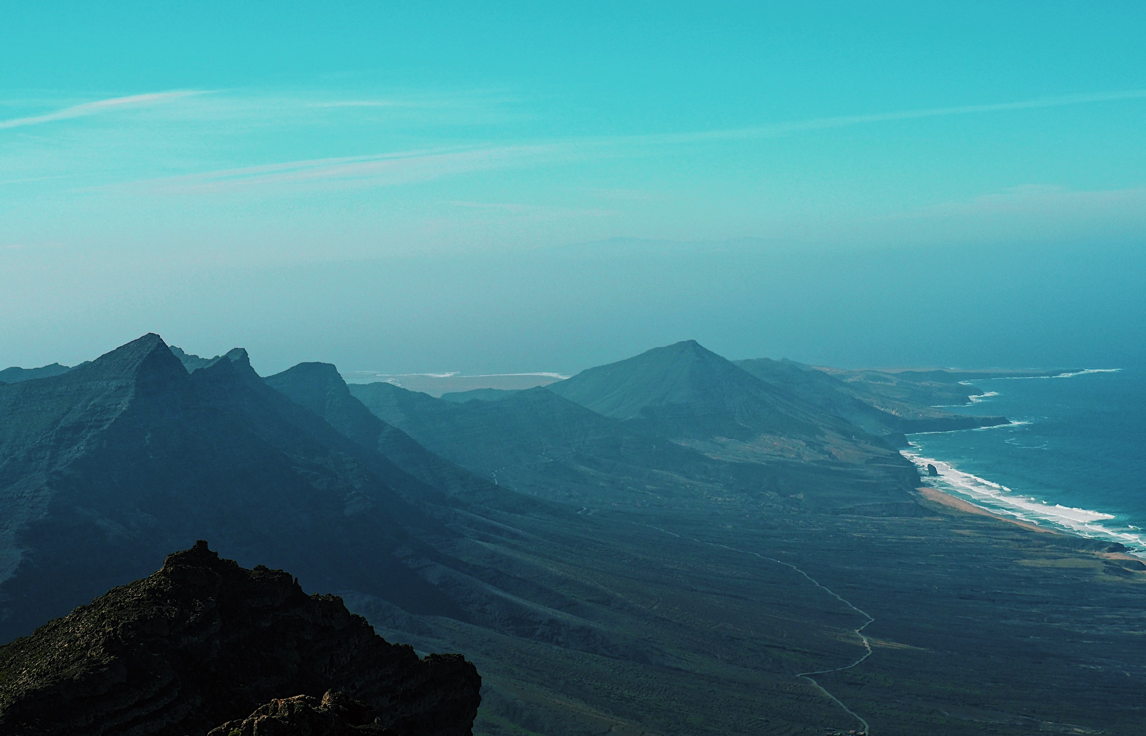 View over mountain and coast line from Pico de la Zarza while hiking on Fuerteventura, Spain