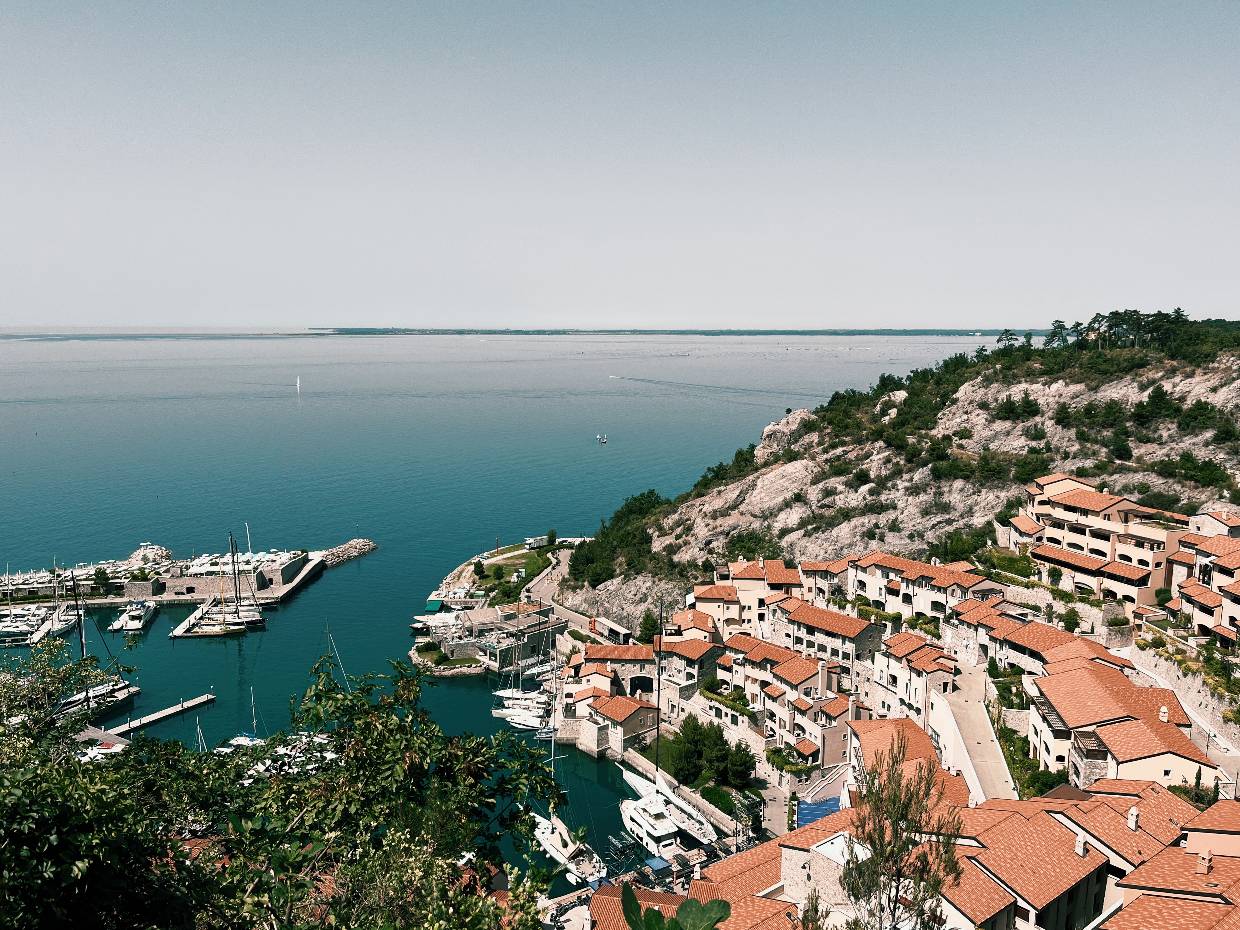 Village on Adriatic Coast with Sea in the Back seen from the Alpe Adria Trail