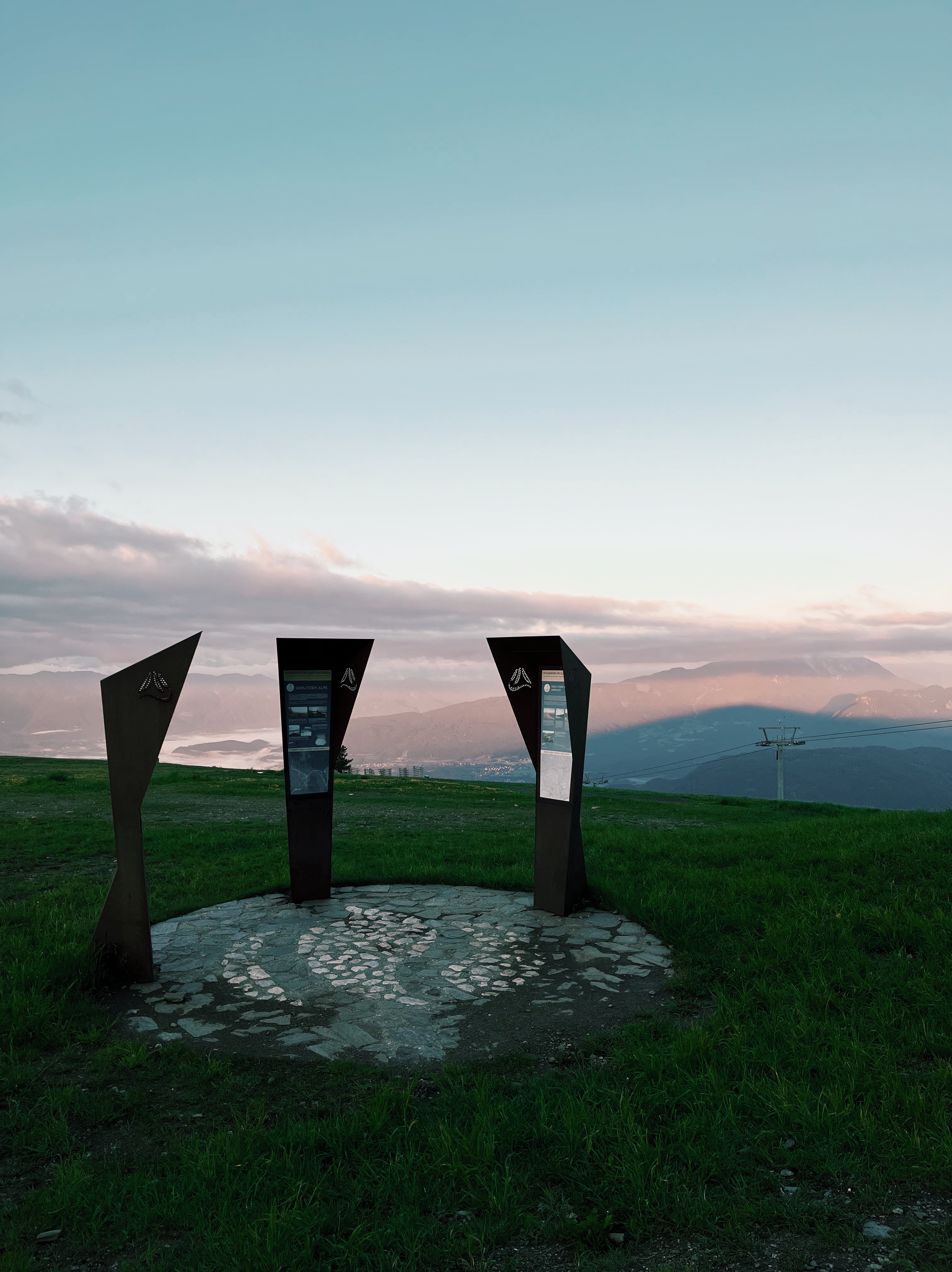 Three statues at dawn  on the Alpe Adria Trail, a long-distance hiking trail in Europe